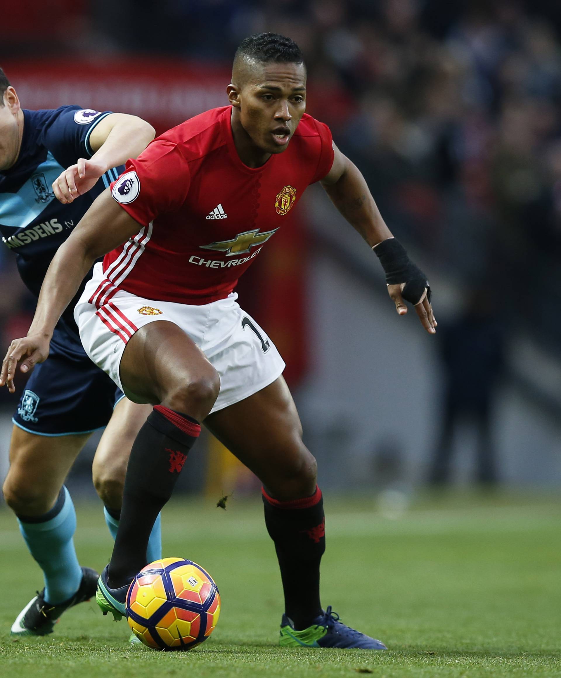 Manchester United's Antonio Valencia in action with Middlesbrough's Stewart Downing