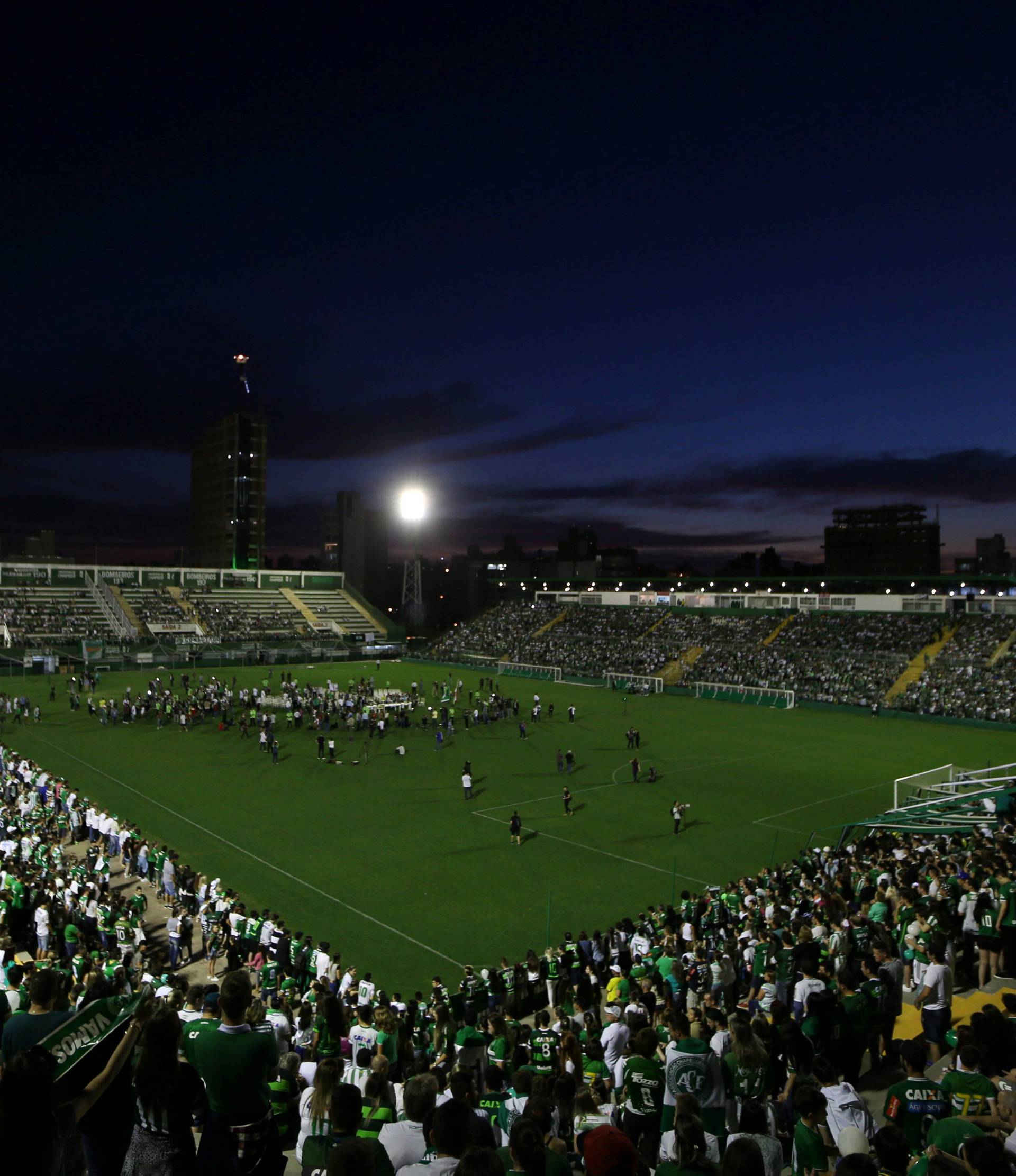 Fans of Chapecoense soccer team pay tribute to Chapecoense's players at the Arena Conda stadium in Chapeco