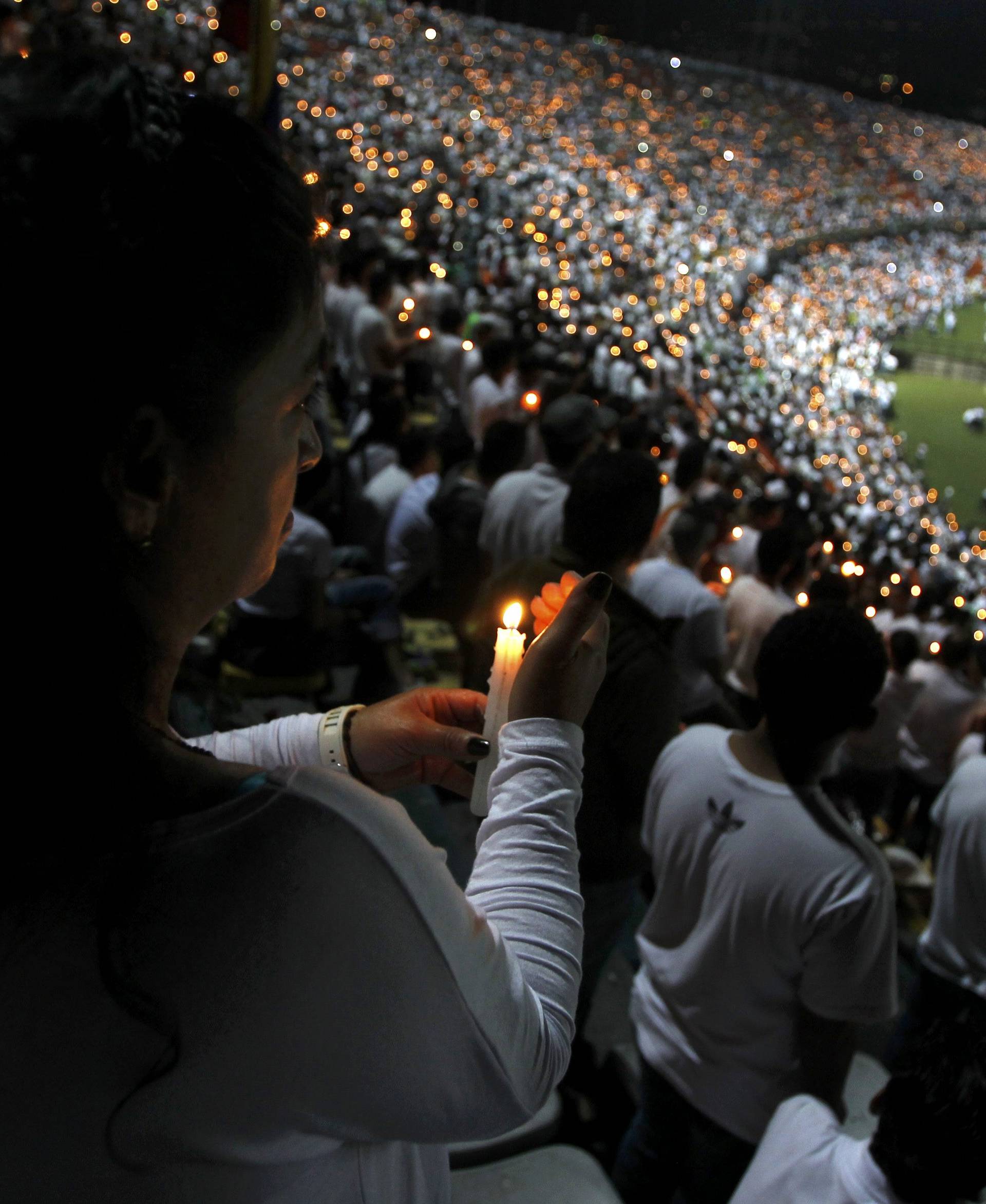 Fans of Atletico Nacional soccer club pay tribute to the players of Brazilian club Chapecoense killed in the recent airplane crash in Medellin