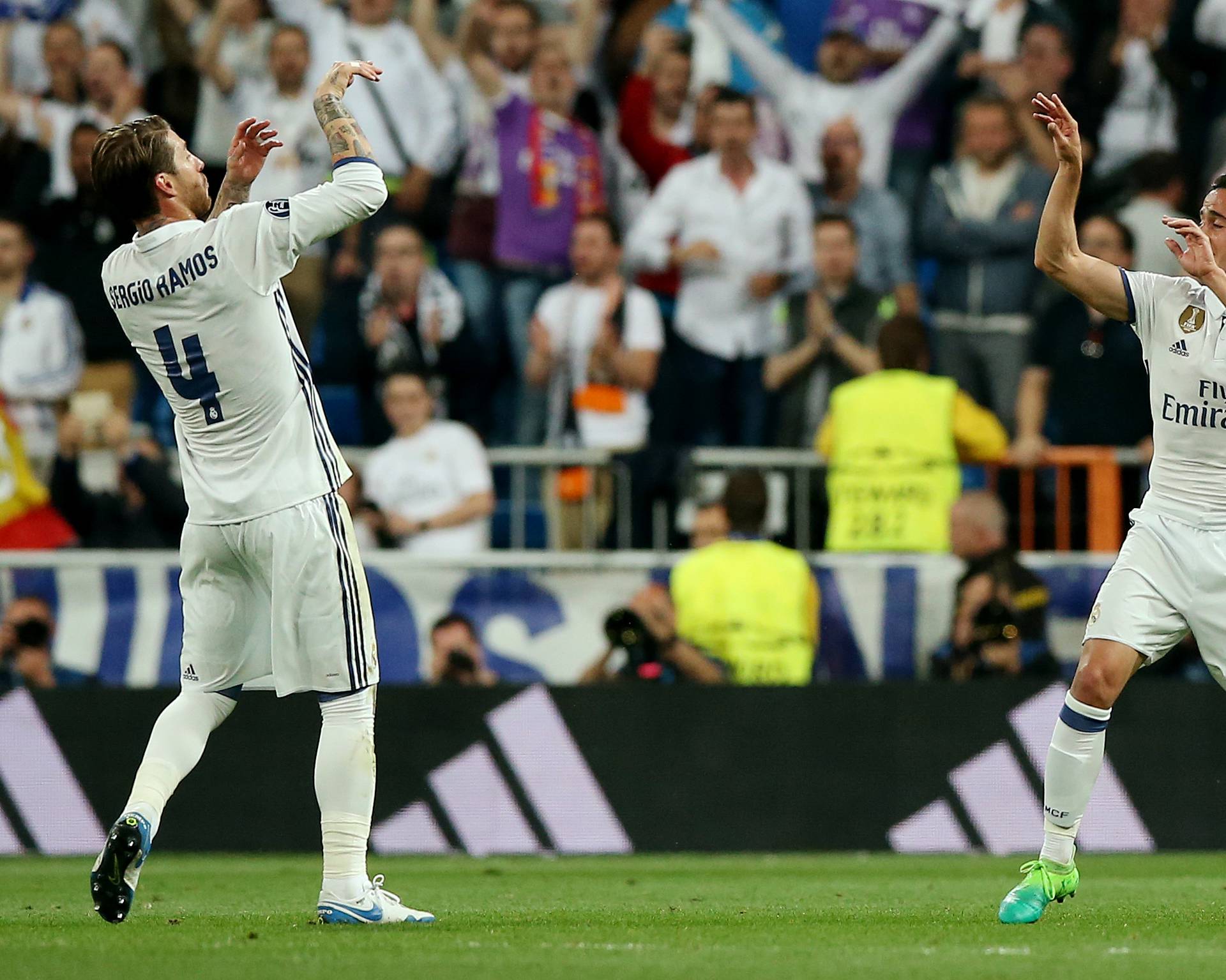 Real Madrid's Sergio Ramos and Lucas Vazquez celebrate after the match