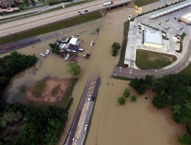 Flood waters cover the area of FM 1463 at IH-10 in Fort Bend County