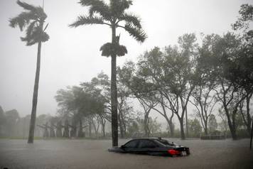 A partially submerged car is seen at a flooded area in Coconut Grove as Hurricane Irma arrives at south Florida, in Miami