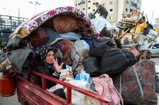 Displaced Palestinians wait to be allowed to return to their homes in northern Gaza, in the central Gaza Strip