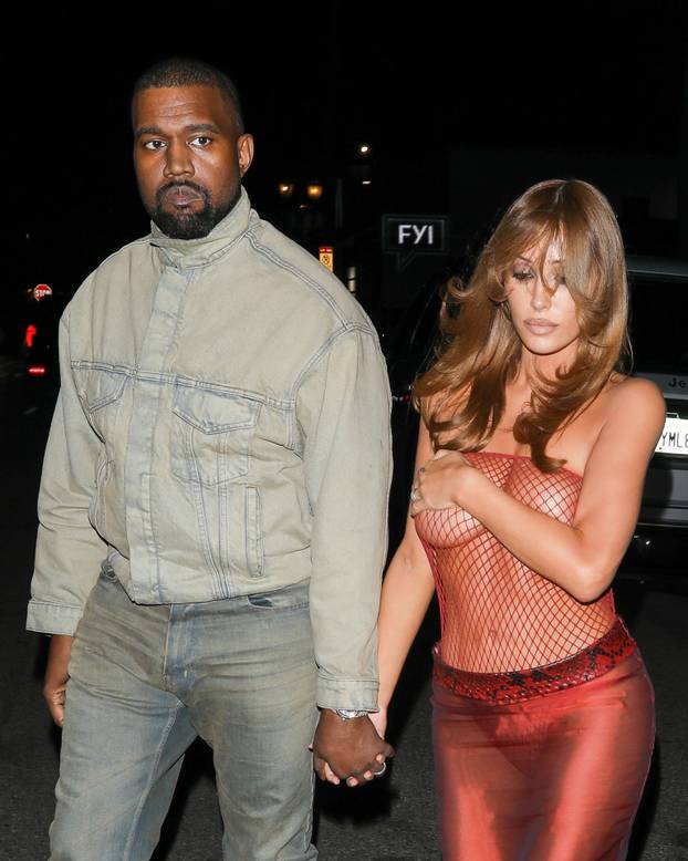 *PREMIUM-EXCLUSIVE* Bianca Censori Rocks Red Fishnet Top Leaving Living Room Club with Kanye West in LA