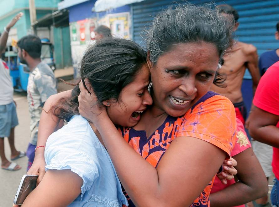 People who live near the church that was attacked yesterday, leave their houses as the military try to defuse a suspected van before it exploded in Colombo