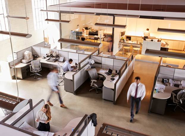 Elevated,View,Of,Staff,Working,In,A,Busy,Open,Plan