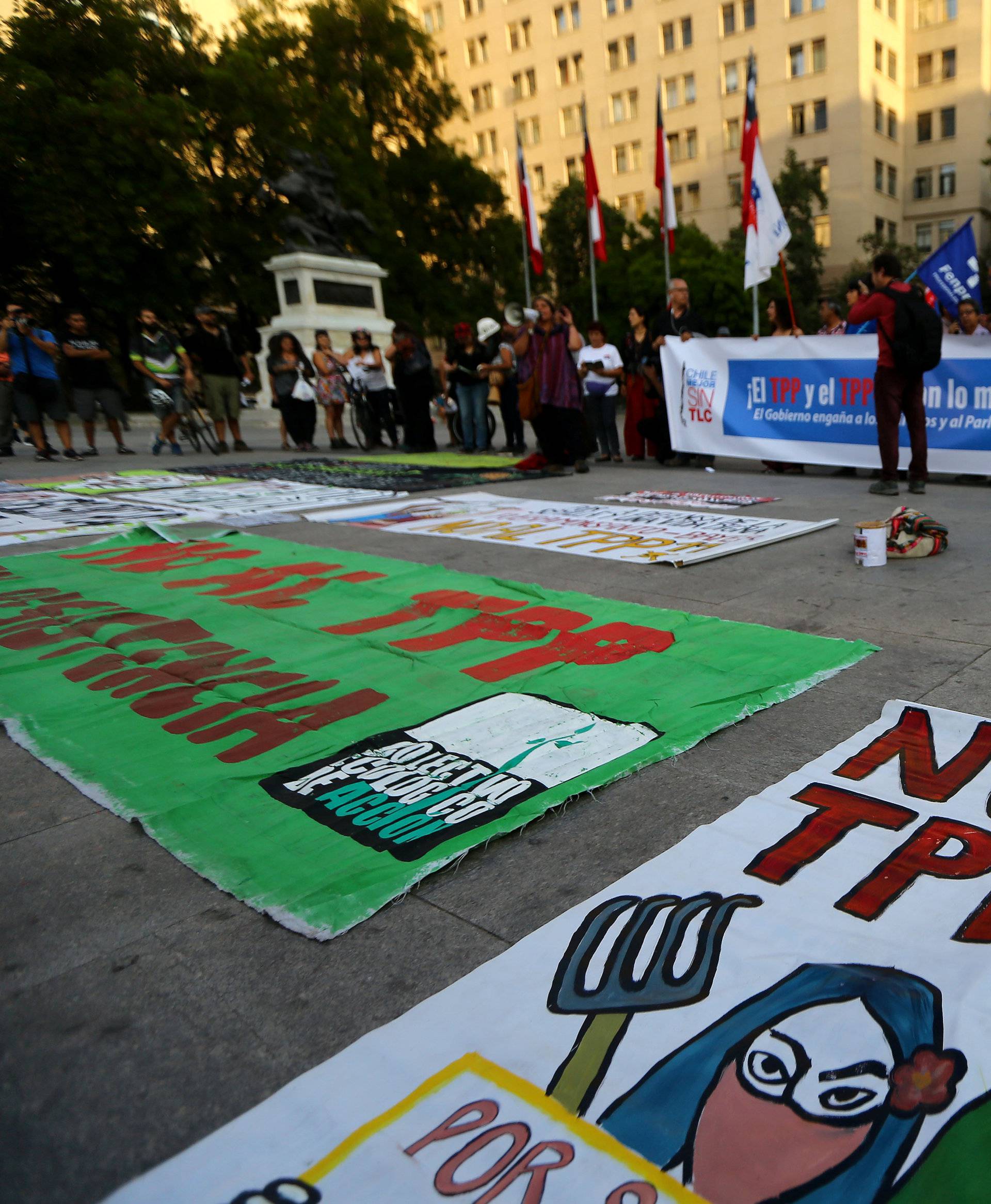 A banner reading "Not to TPP" lies on the ground during a rally against the Trans-Pacific Partnership (TPP) trade deal in Santiago,