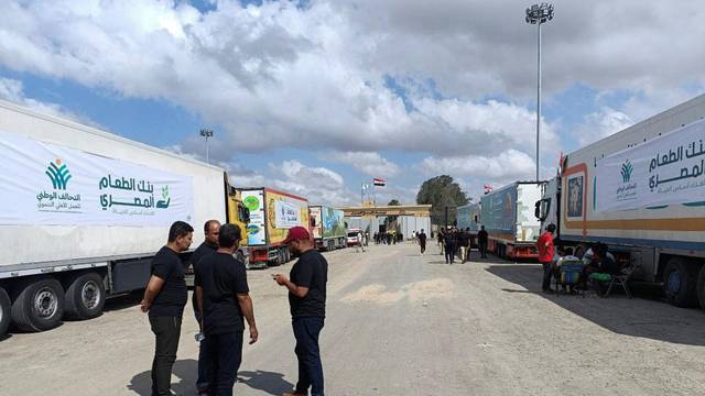 Trucks carrying humanitarian aid from Egyptian NGOs for Palestinians, wait for the reopening of the Rafah crossing at the Egyptian side