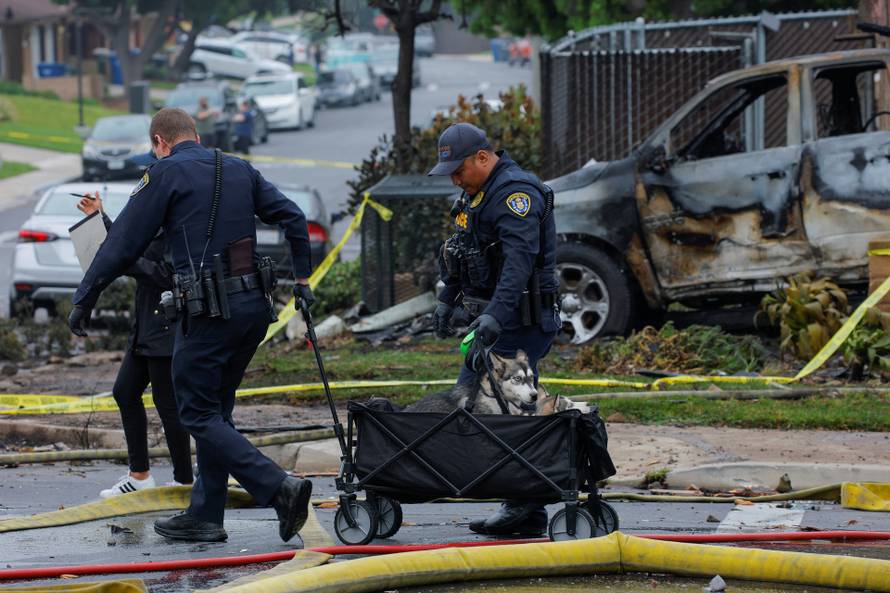 Crash scene after a civilian aircraft went down in a neighborhood, in San Diego