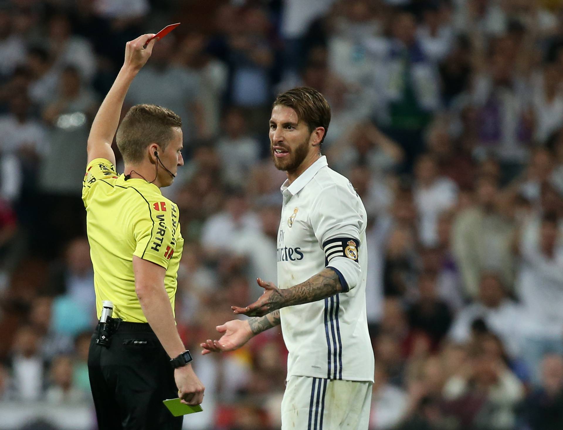 Real Madrid's Sergio Ramos is shown a red card by referee Alejandro Hernandez