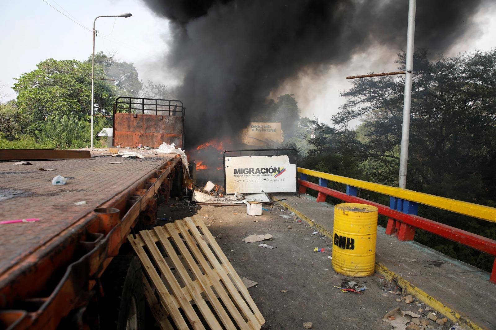 Truck that was carrying humanitarian aid for Venezuela is seen on fire, from Cucuta