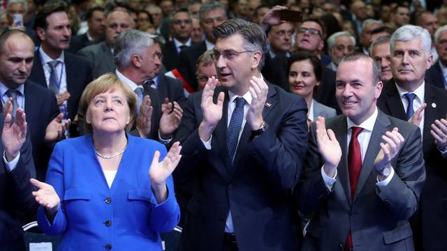 Croatia's Prime Minister Andrej Plenkovic, German Chancellor Angela Merkel and Manfred Weber of the European People's Party during EPP and the Croatian Democratic Union's campaign rally for the European Parliament elections in Zagreb