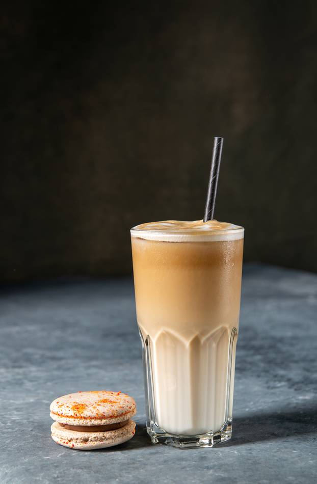 Coffee,In,A,Glass,With,Cream,Poured,Over,And,Macaron