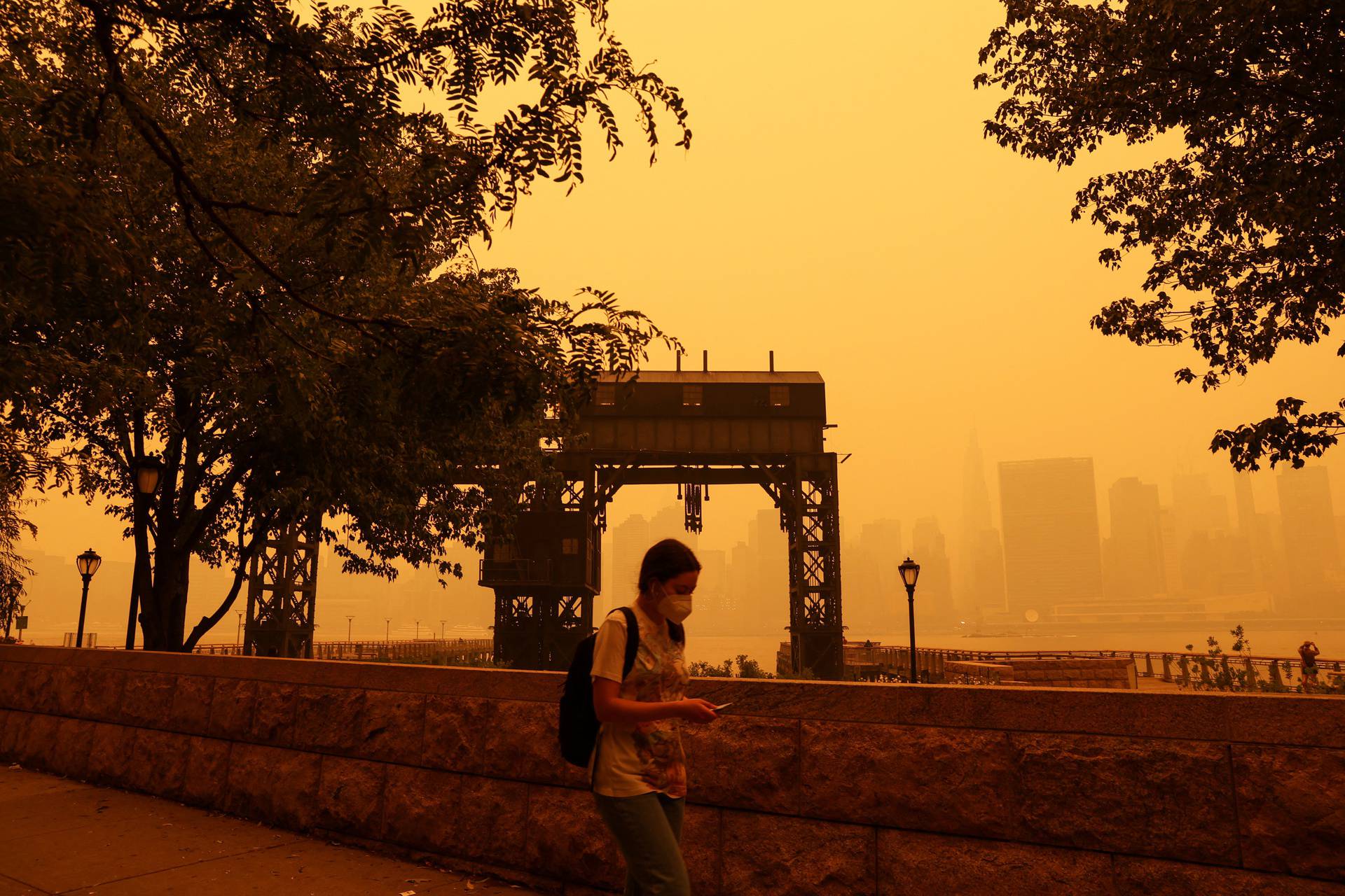 Haze and smoke shroud Manhattan skyline from Canadian wildfires in New York