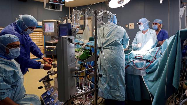 Medical team perform a heart surgery in an operating room at the Saint-Augustin clinic in Bordeaux