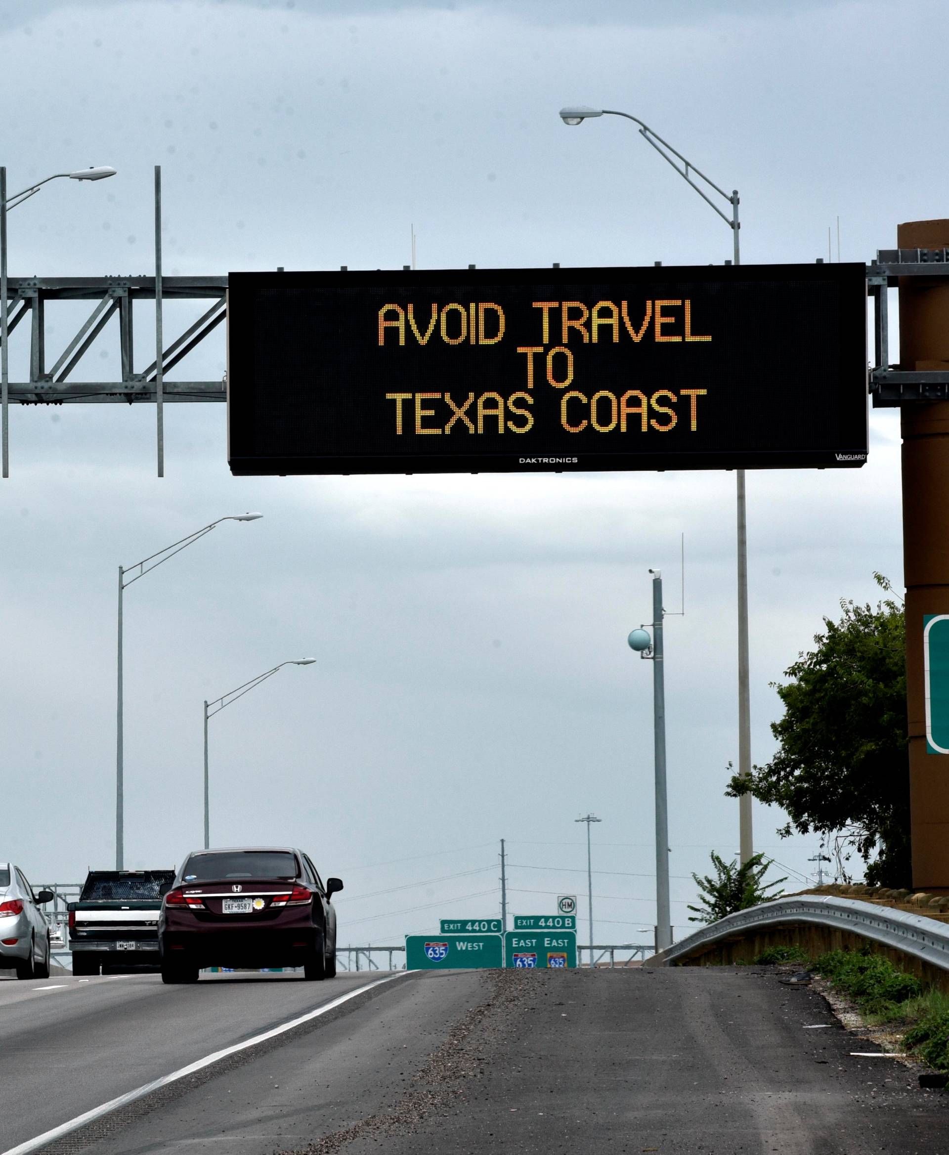 A sign along I-35E warns against travel southeast Texas after Hurricane Harvey made landfall on the Texas Gulf coast