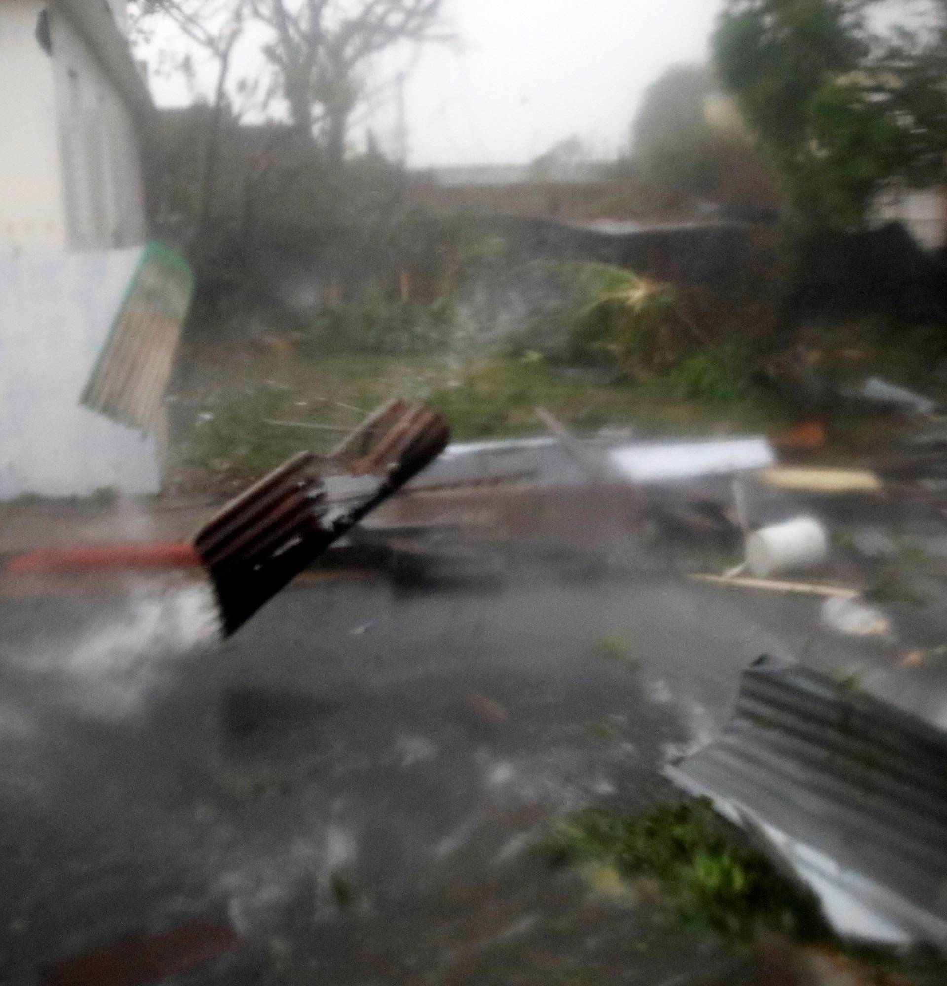 Constructions debris are carried by the wind after the area was hit by Hurricane Maria in Guayama