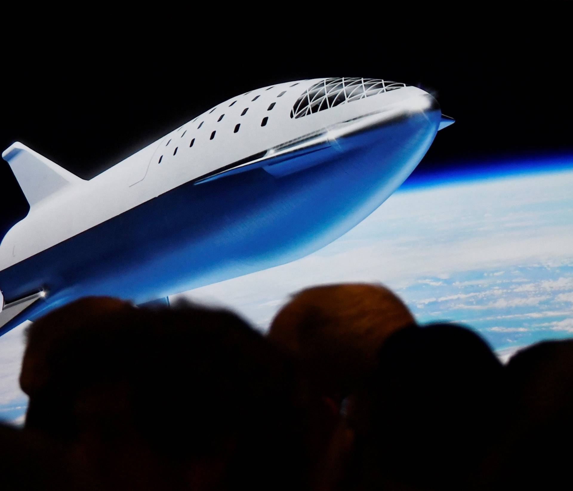 SpaceX CEO Elon Musk shows how the new BFR works during a press conference announcing the worldâs first private passenger scheduled to fly around the Moon aboard SpaceXâs BFR launch vehicle, at the company's headquarters in Hawthorne