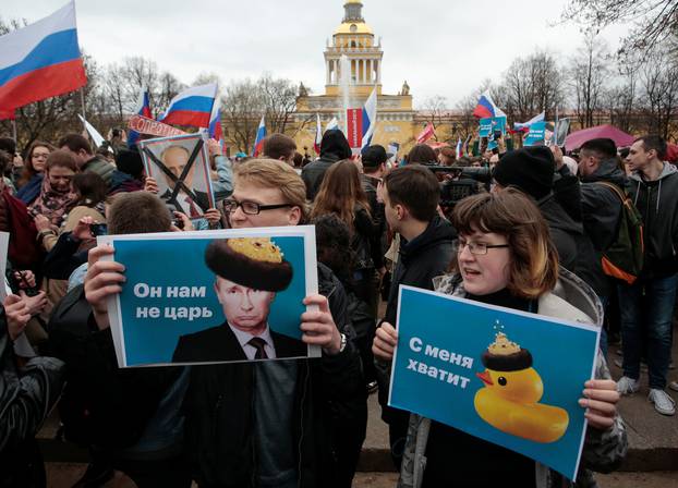 Opposition supporters attend a protest rally ahead of President Vladimir Putin