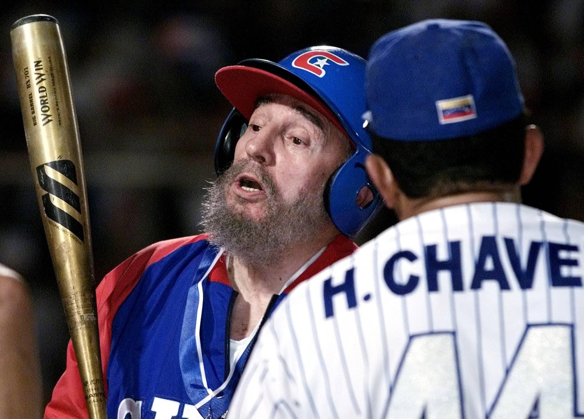 File photo of then Cuban President Fidel Castro and Venezuelan President Hugo Chavez joking during a batting session in a friendly baseball game between their two countries at the Barquisimeto baseball stadium