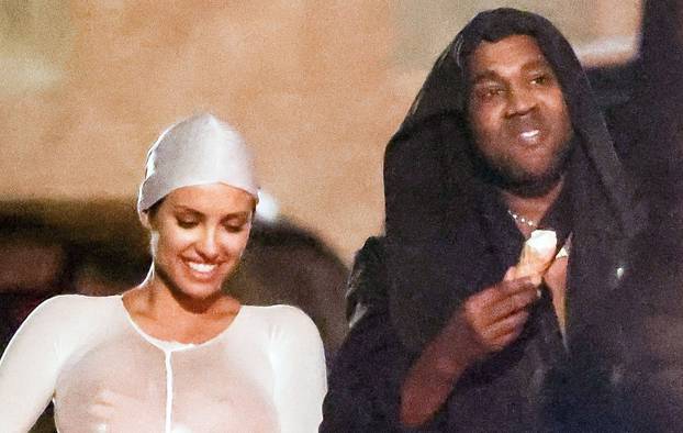 *PREMIUM-EXCLUSIVE* *MUST CALL FOR PRICING* *WEB EMBARGO UNTIL 21:00 HRS UK TIME ON 10/08/23* The American Rapper Kanye West is all smiles looking happy with his reported 'Wife' Bianca Censori as they enjoy cool scrumptious Gelato and take a stroll barefo
