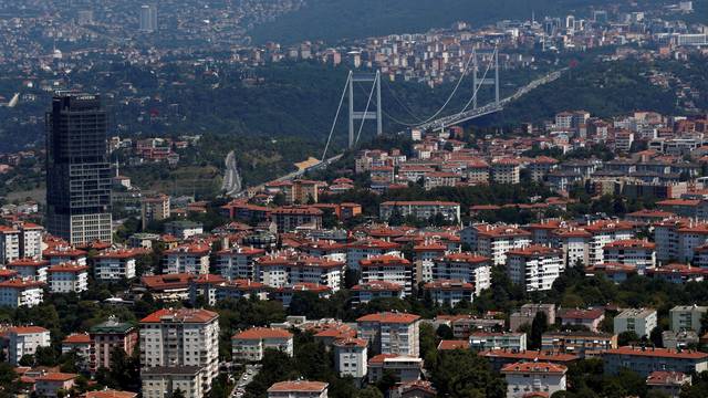 The Fatih Sultan Mehmet Bridge is seen behind residential apartment blocks in Istanbul