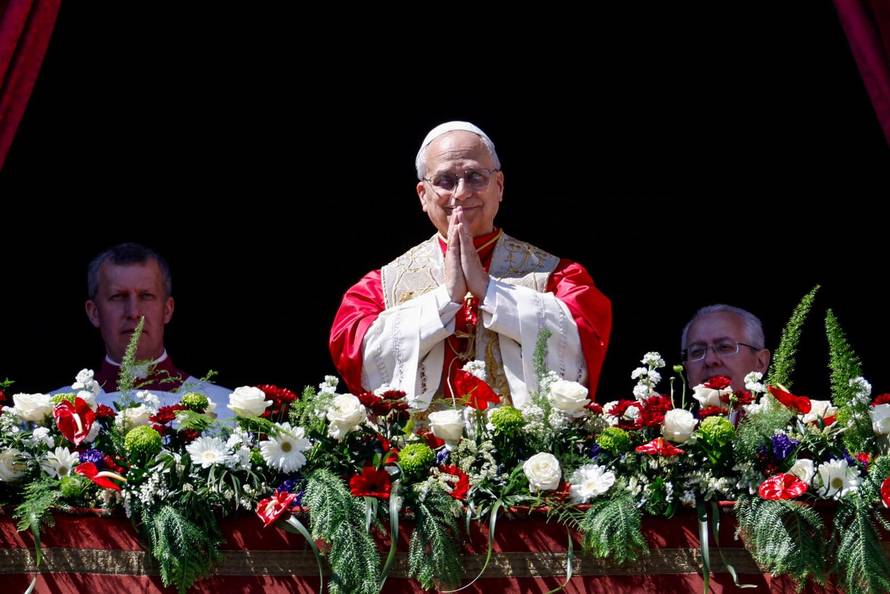 Pope Leo XIV delivers his "Urbi et Orbi" (To the city and the world) message from the main balcony of St. Peter's Basilica