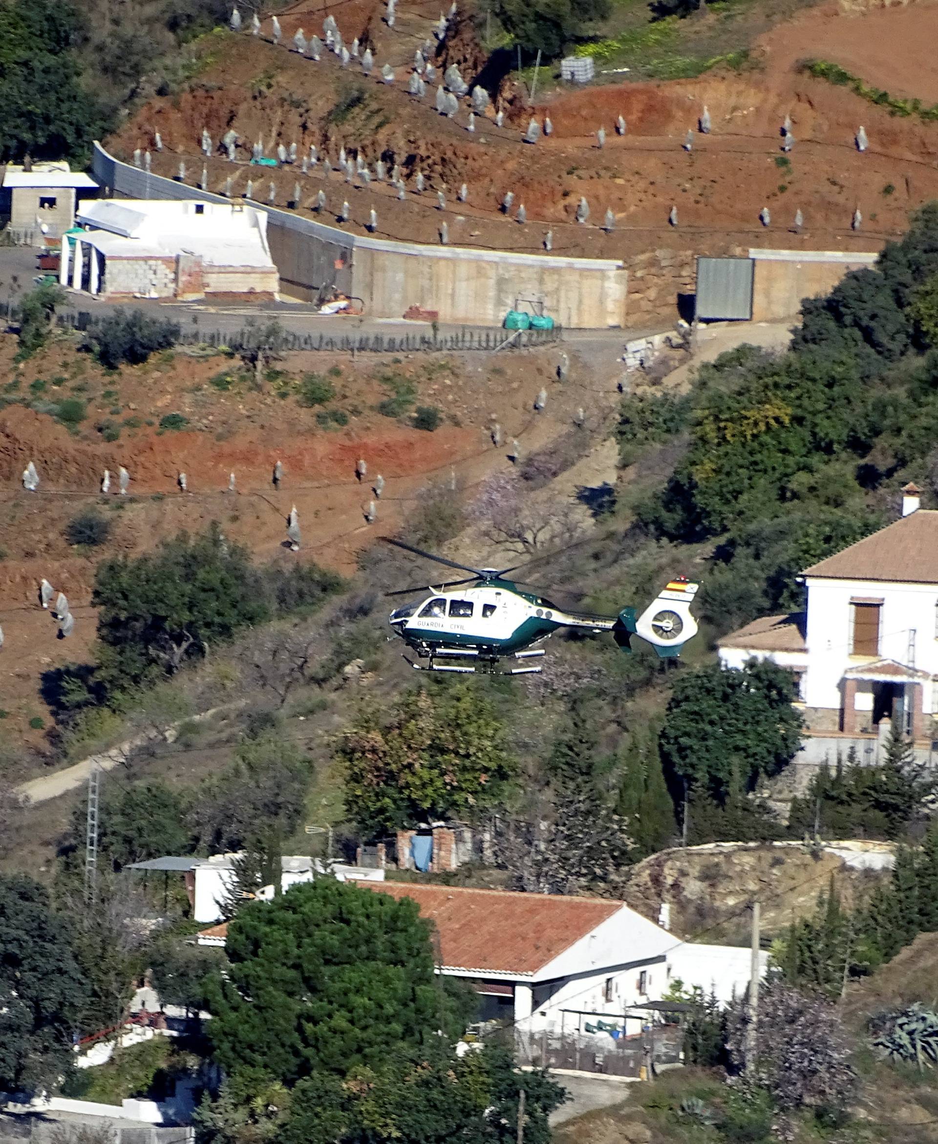 A Spanish Civil Guard helicopter is seen taking off to pick explosives in Sevilla from the area where Julen, a Spanish two-year-old boy, fell into a deep well, in Totalan