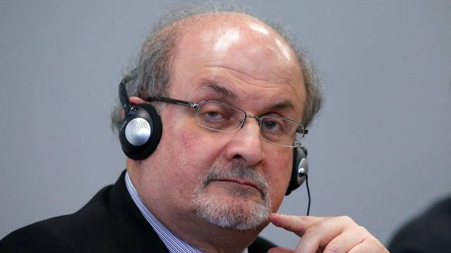 FILE PHOTO: Author Rushdie listens during the opening news conference of the Frankfurt book fair