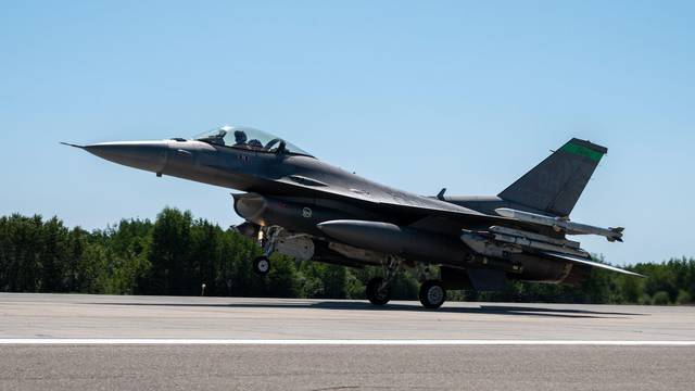 An F-16 Fighting Falcon from the Ohio Air National Guard's 112th Fighter Squadron lands in preparation for the Global Information Dominance Experiment 3 at Alpena Combat Readiness Training Center, Alpena, Michigan, July 10, 2021. North American Aerospace 