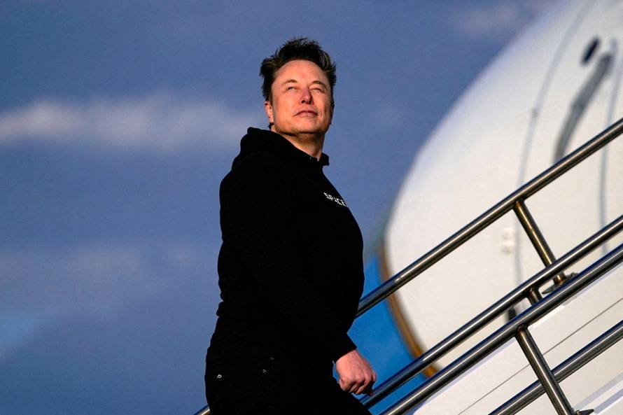 FILE PHOTO: Tesla CEO Elon Musk boards Air Force One in New Jersey