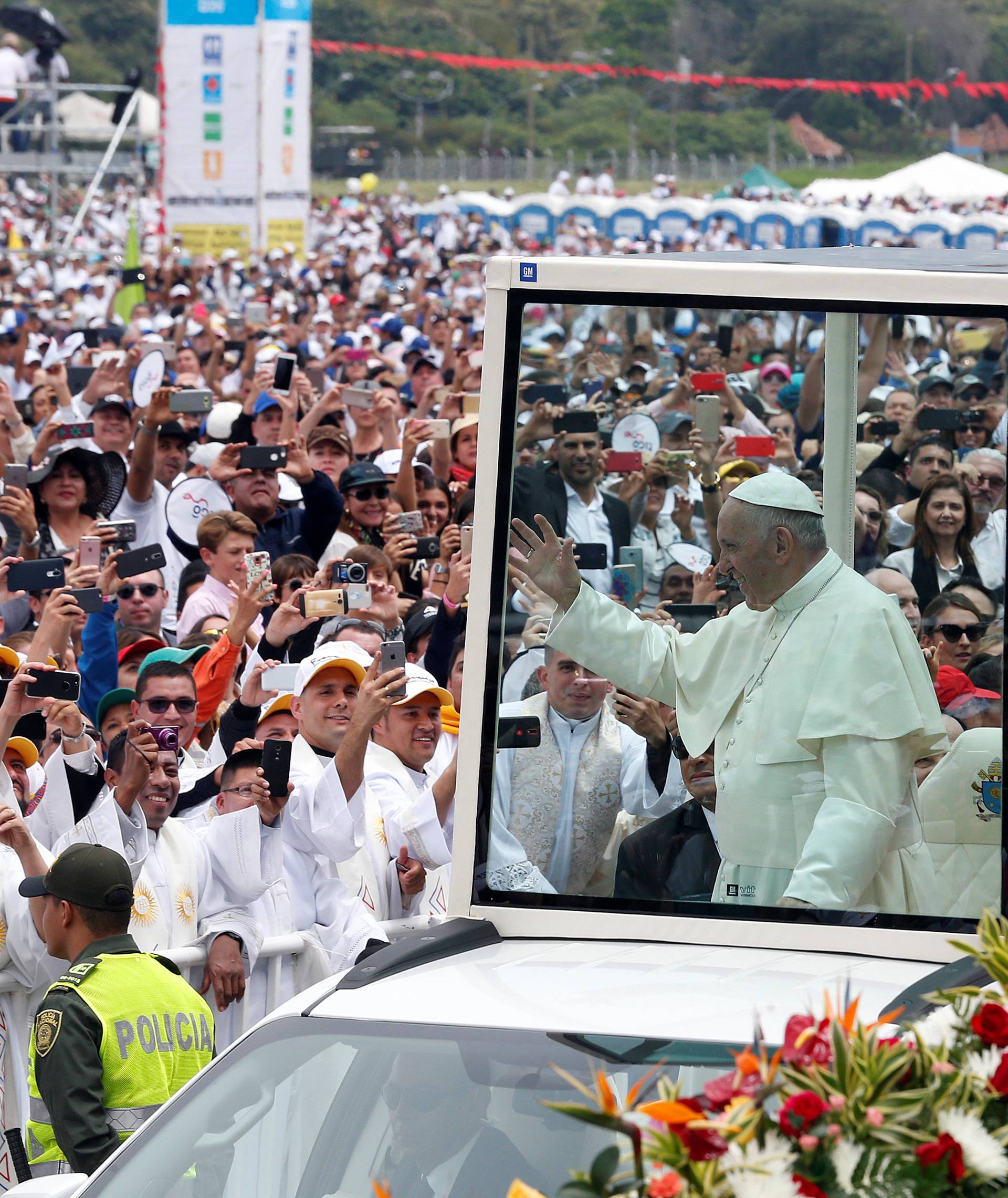 Pope Francis arrives on the popemobile for a holy mass at Enrique Olaya Herrera airport in Medellin