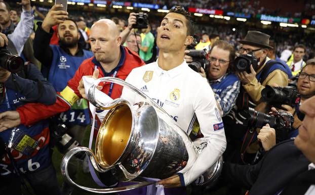 Real Madrid's Cristiano Ronaldo celebrates with the trophy after winning the UEFA Champions League Final