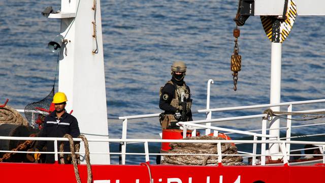 A Maltese special forces soldier is seen on the merchant ship Elhiblu 1 after it arrived in Senglea