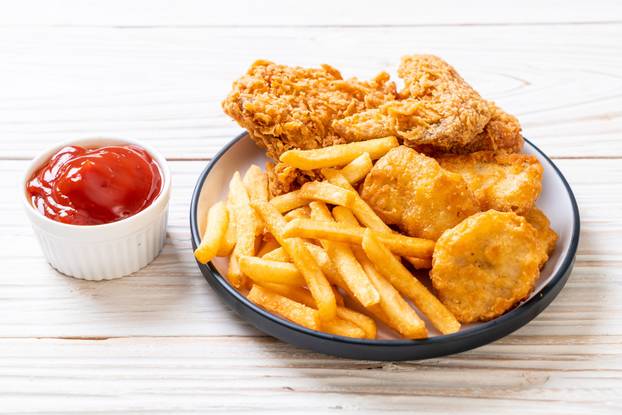 fried chicken with french fries and nuggets meal