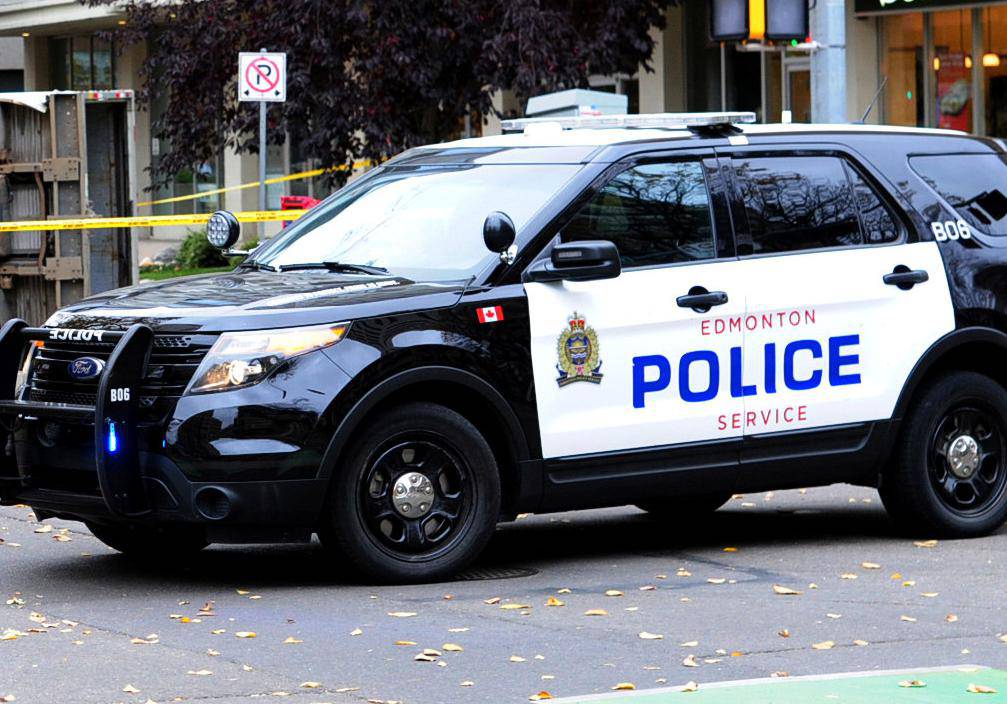 Edmonton Police investigate at the scene where a man hit pedestrians then flipped the U-Haul truck in Edmonton