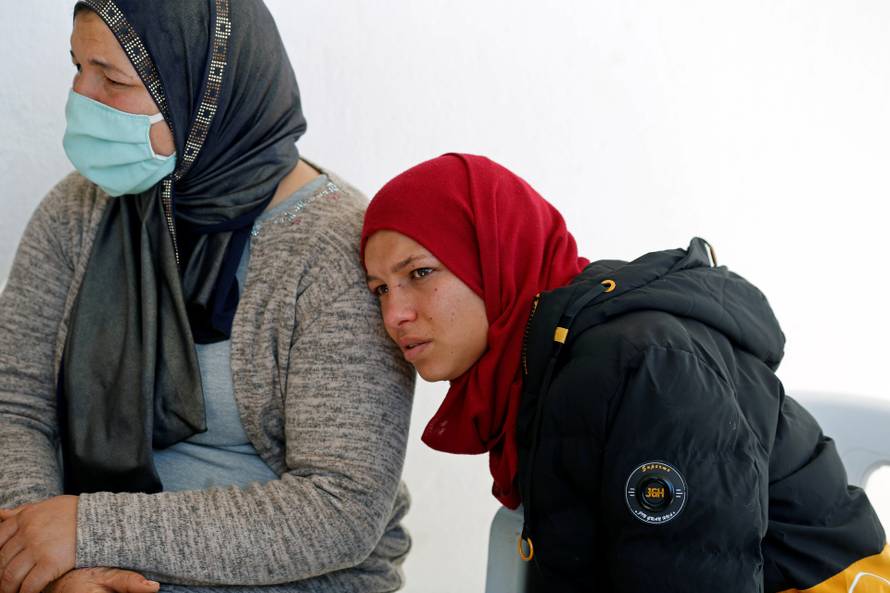 The family of Brahim Aouissaoui, who is suspected of carrying out Thursday's attack in Nice, France, are pictured at their home in Thina, a suburb of Sfax