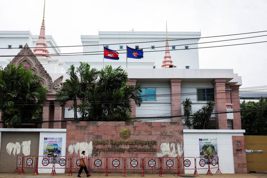 A woman walks past the Royal Embassy of Cambodia, after Thailand has recalled its ambassador to Cambodia an expelled Cambodia's ambassador, amid border disputes in Bangkok
