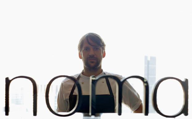 FILE PHOTO: Redzepi poses for pictures behind the logo of Noma at Mandarin Oriental Tokyo