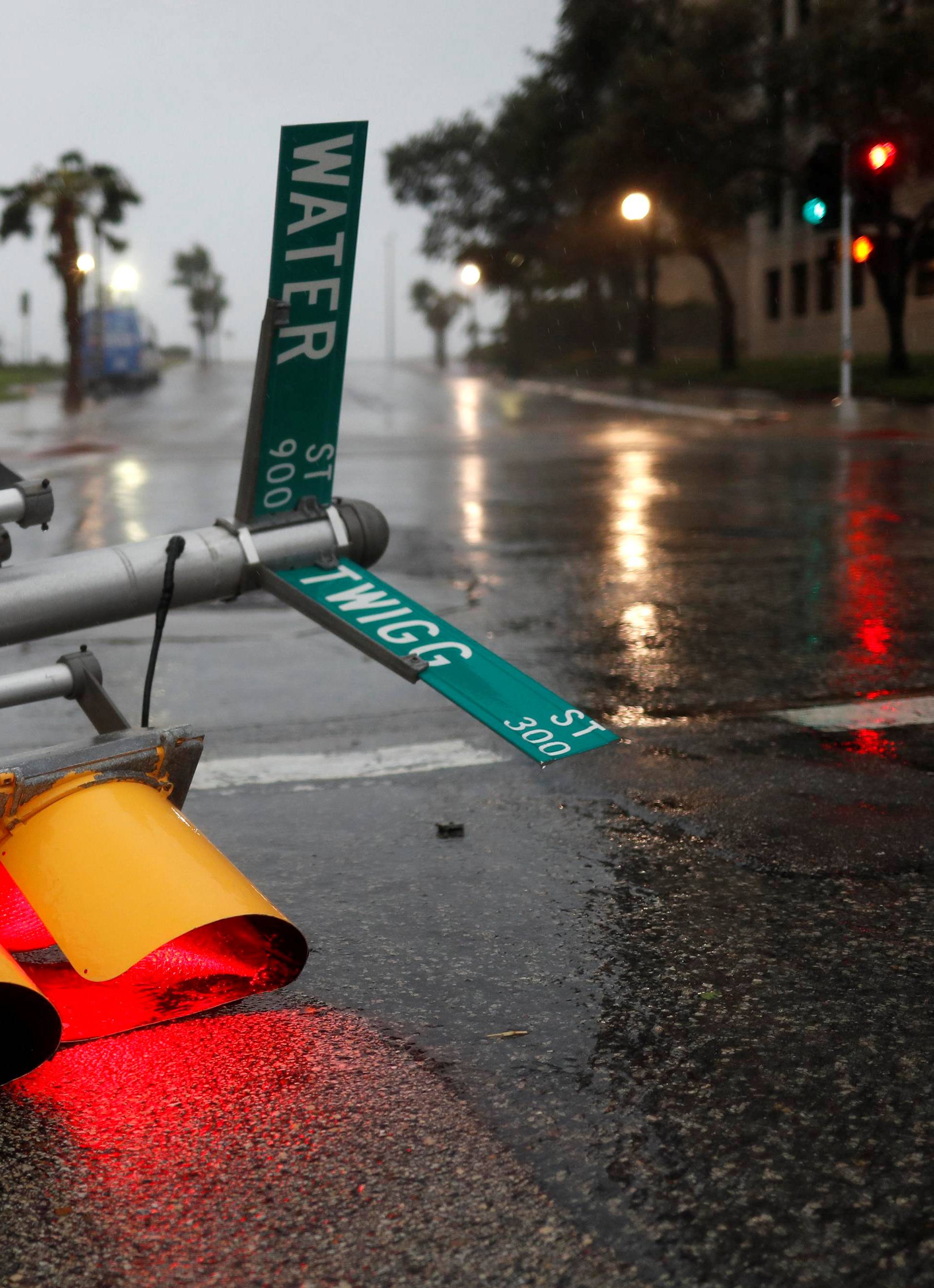 Traffic lights lie on a street after being knocked down, as Hurricane Harvey approaches in Corpus Christi