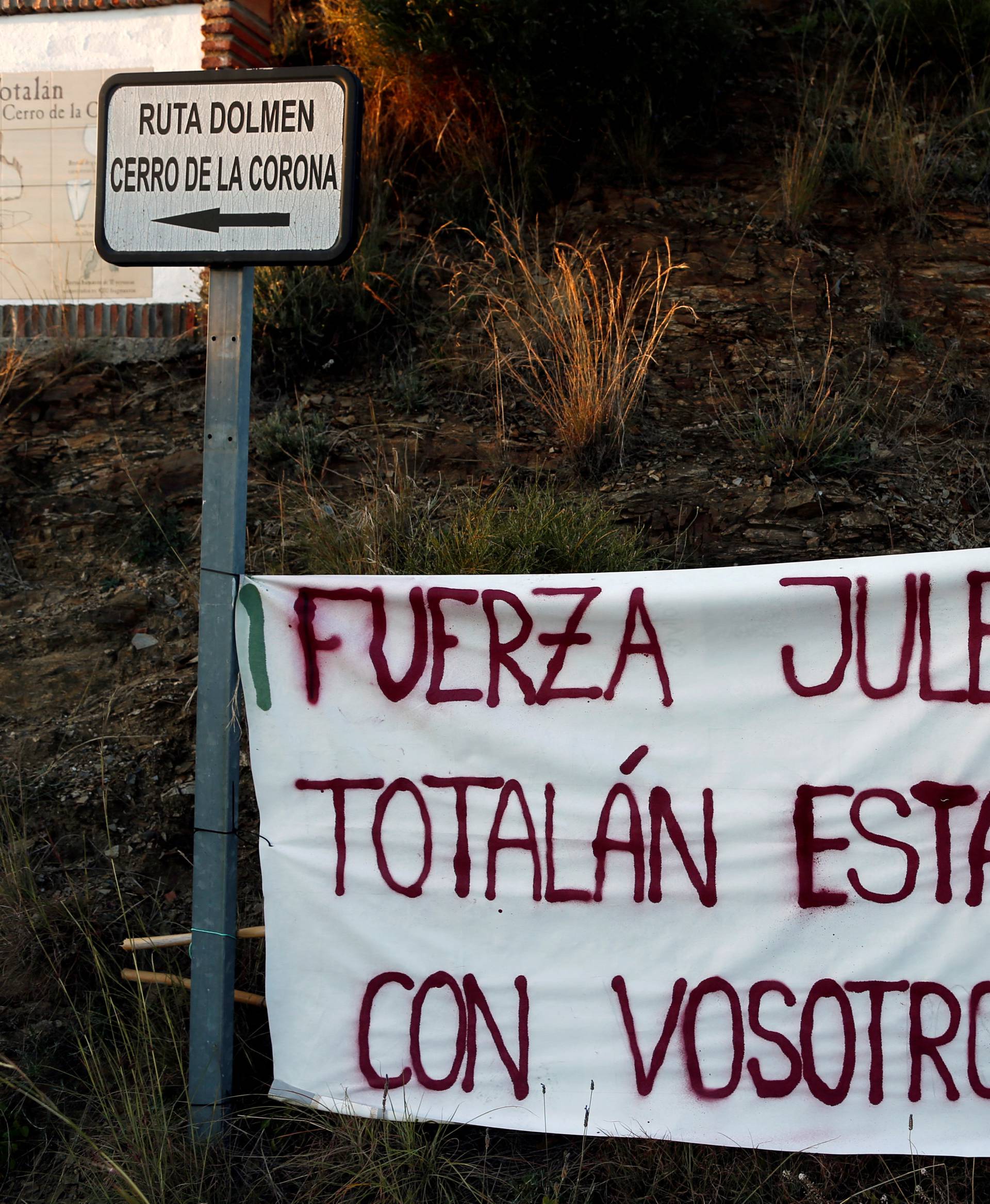 A banner that reads "Force Julen! Totalan is with you", is seen at the area where Julen, a Spanish two-year-old boy fell into a deep well four days ago when the family was taking a stroll through a private estate, in Totalan