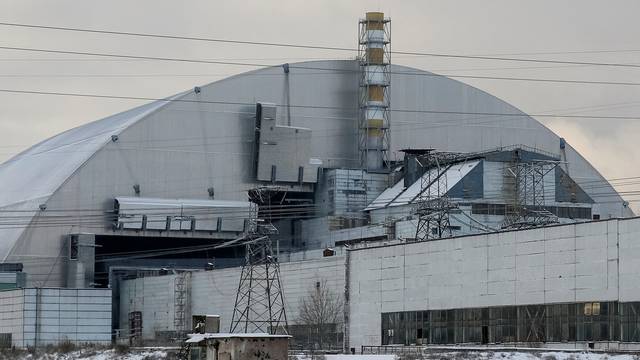 A general view shows a New Safe Confinement structure over the old sarcophagus covering the damaged fourth reactor at the Chernobyl nuclear power plant, in Chernobyl