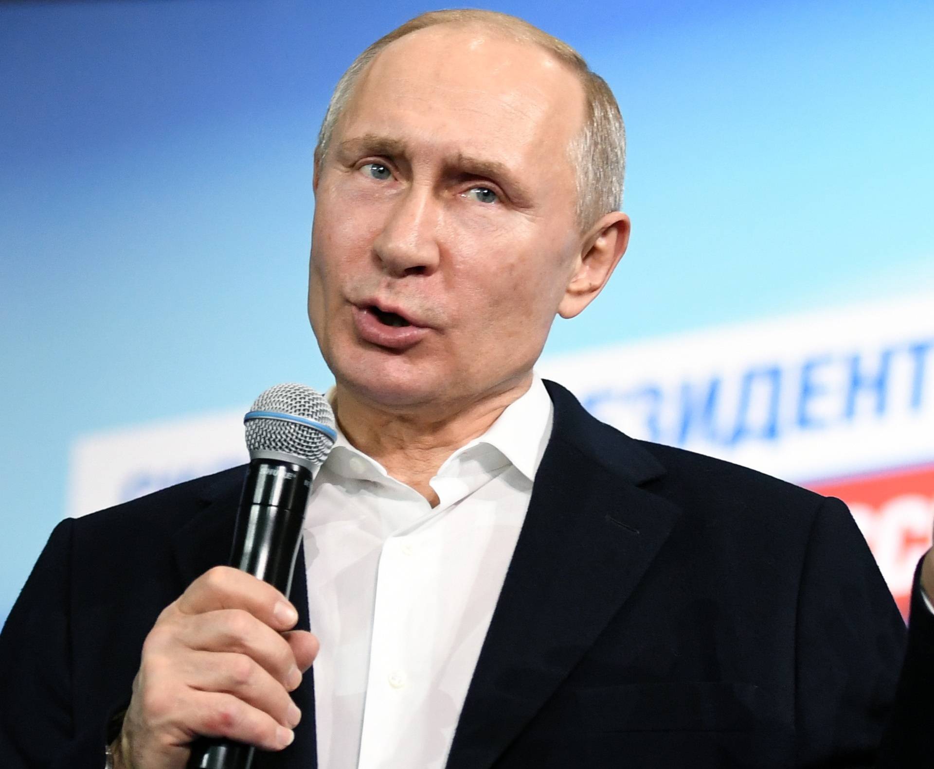 Russian President and Presidential candidate Putin speaks during a meeting with supporters at his campaign headquarters in Moscow