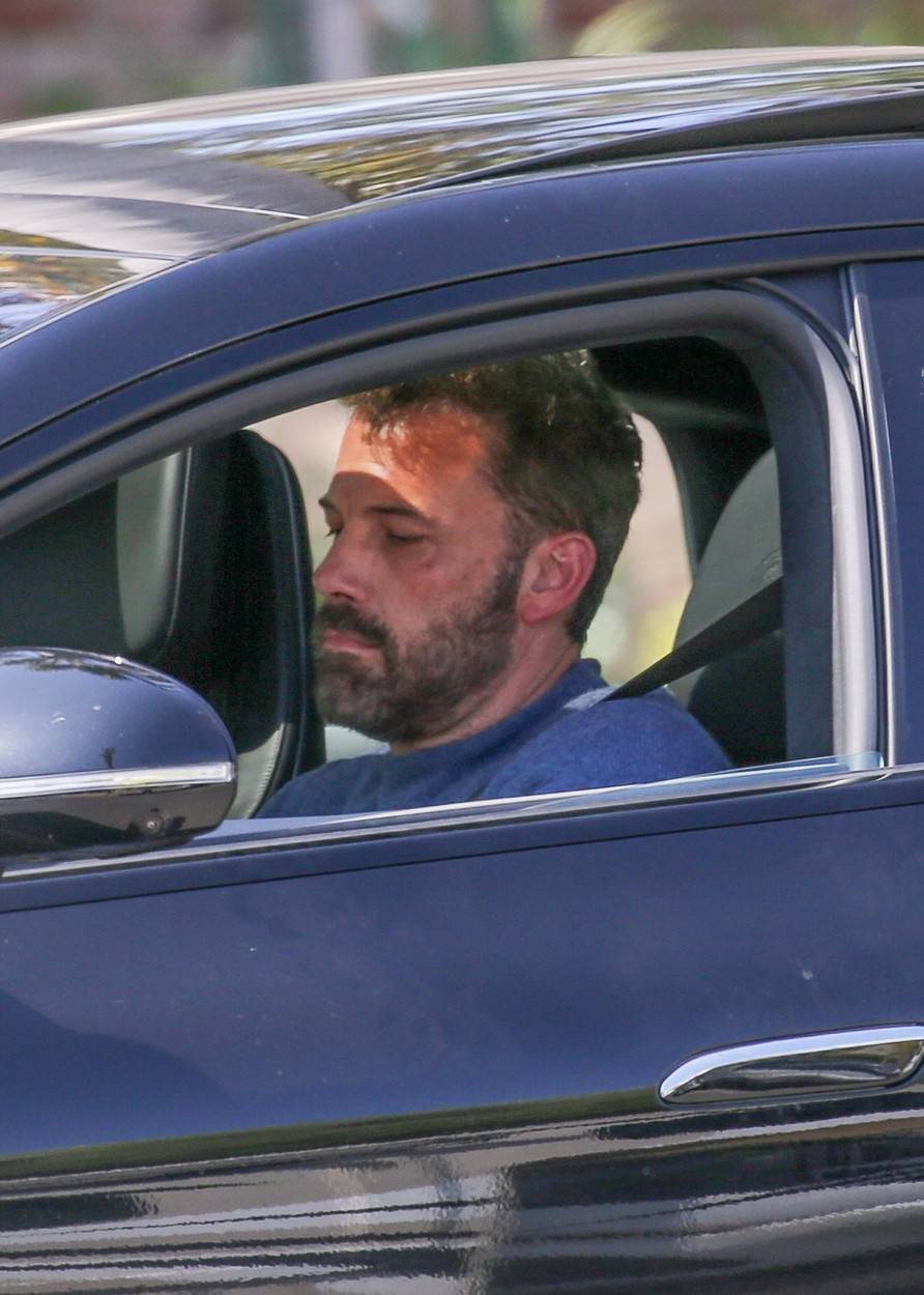 *EXCLUSIVE* Ben Affleck looks busy while driving as he picks up his son Samuel in Santa Monica