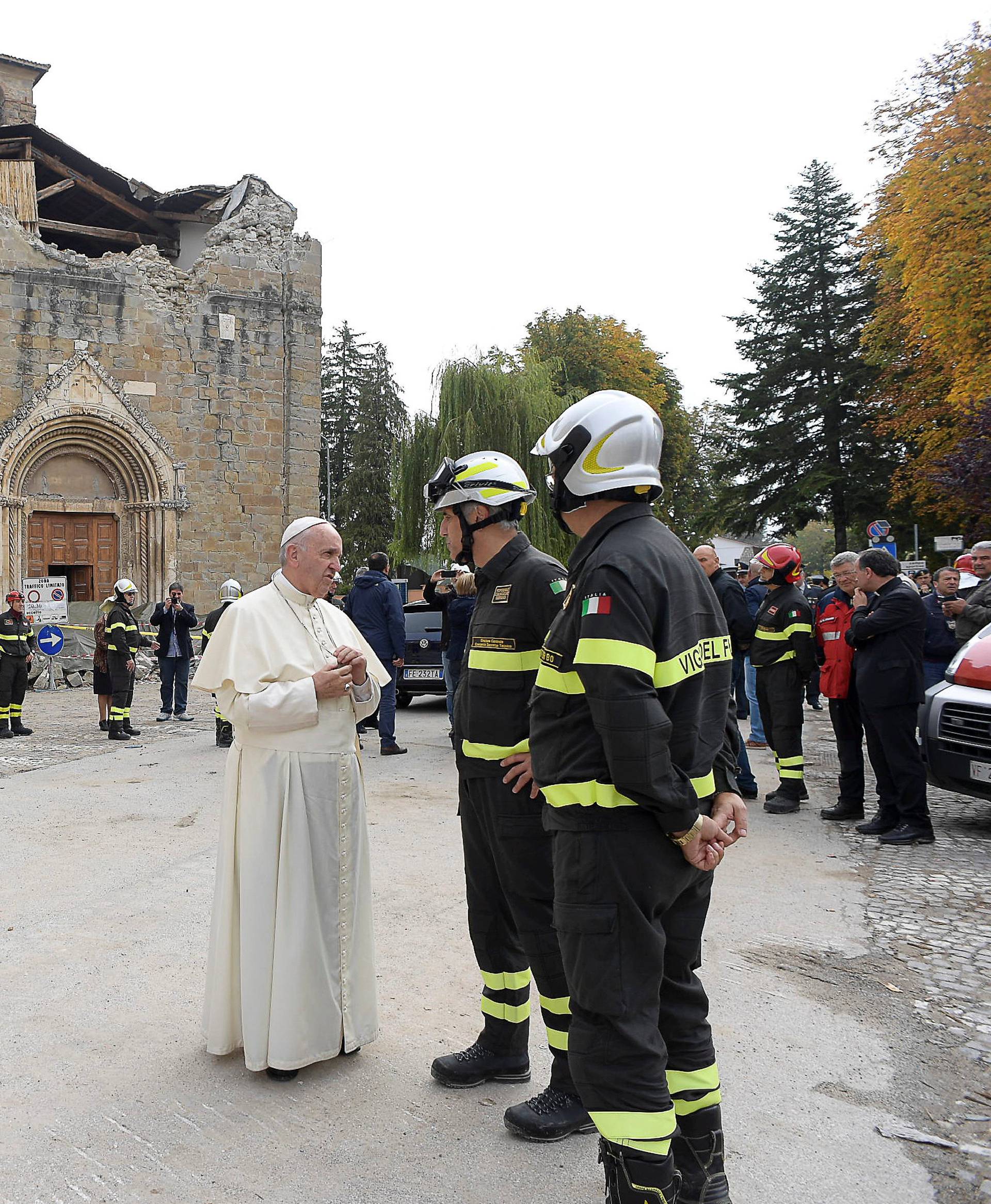 Pope Francis talks with firefighters in Amatrice