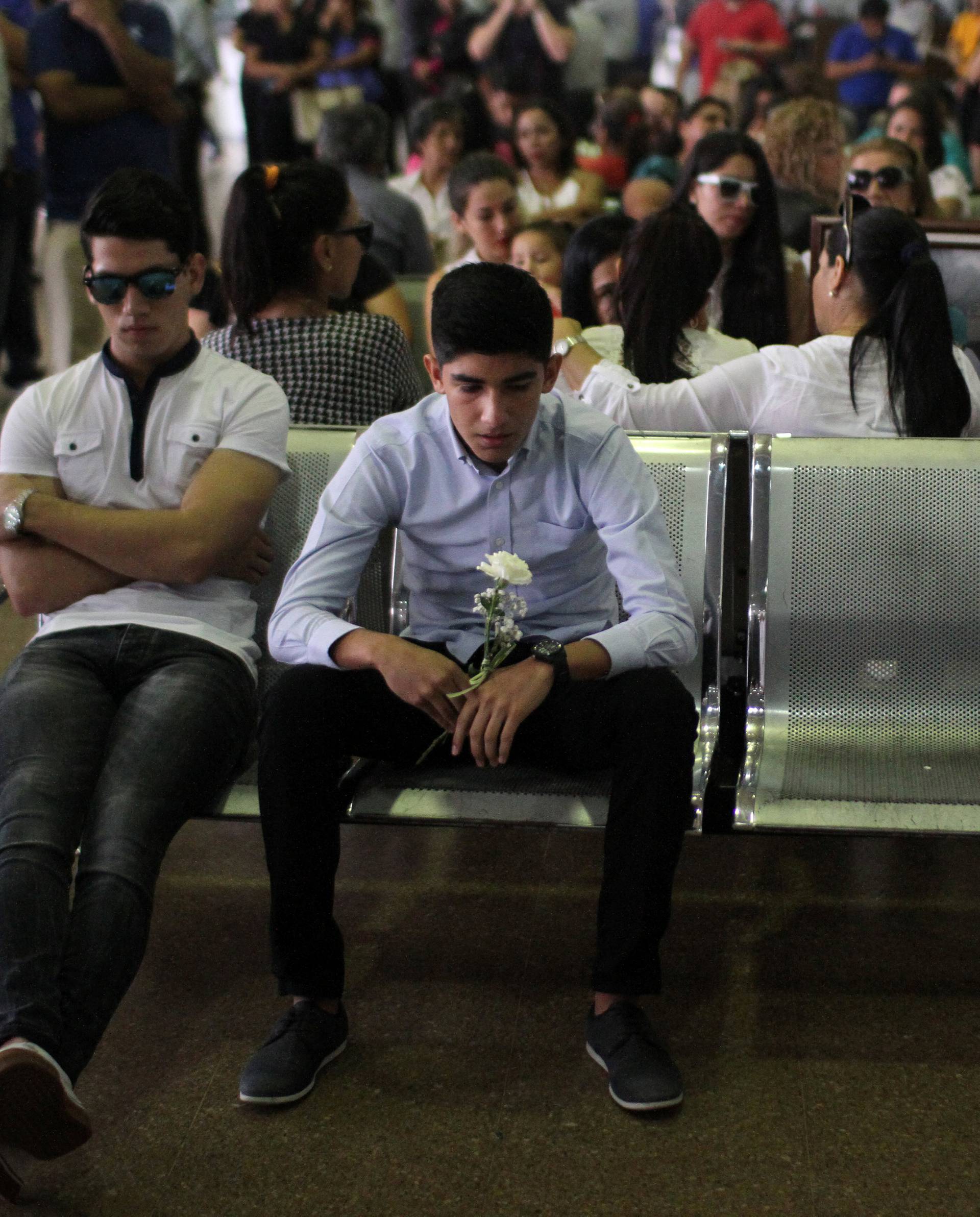 Relatives of victims who died when the plane carrying Brazilian soccer team Chapecoense crashed in Colombia, wait at Viru Viru airport in Santa Cruz