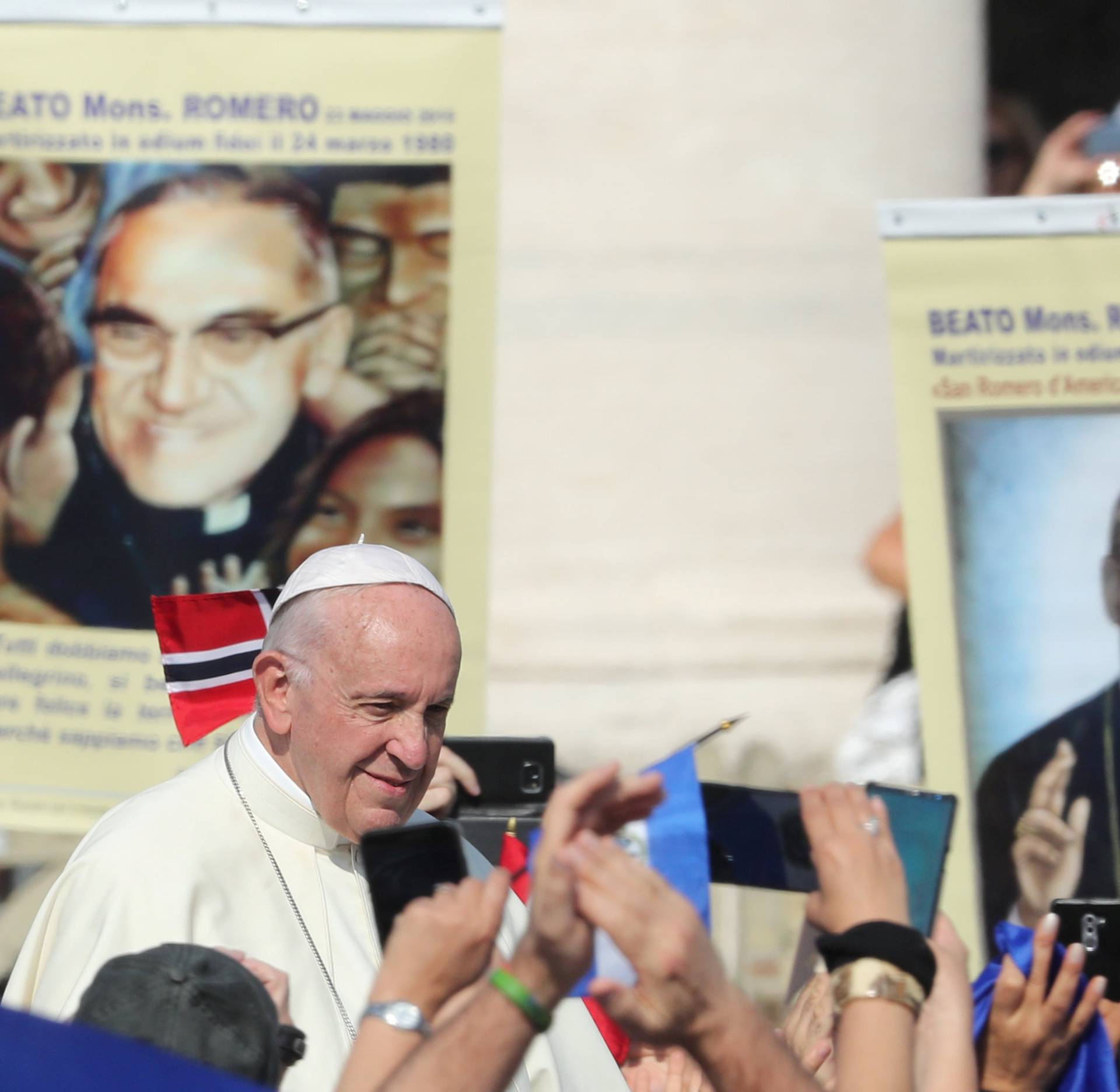 Pope Francis waves as he leaves after leading a Mass for the canonisation of the Pope Paul VI and El Salvador's Archbishop Oscar Romero at the Vatican