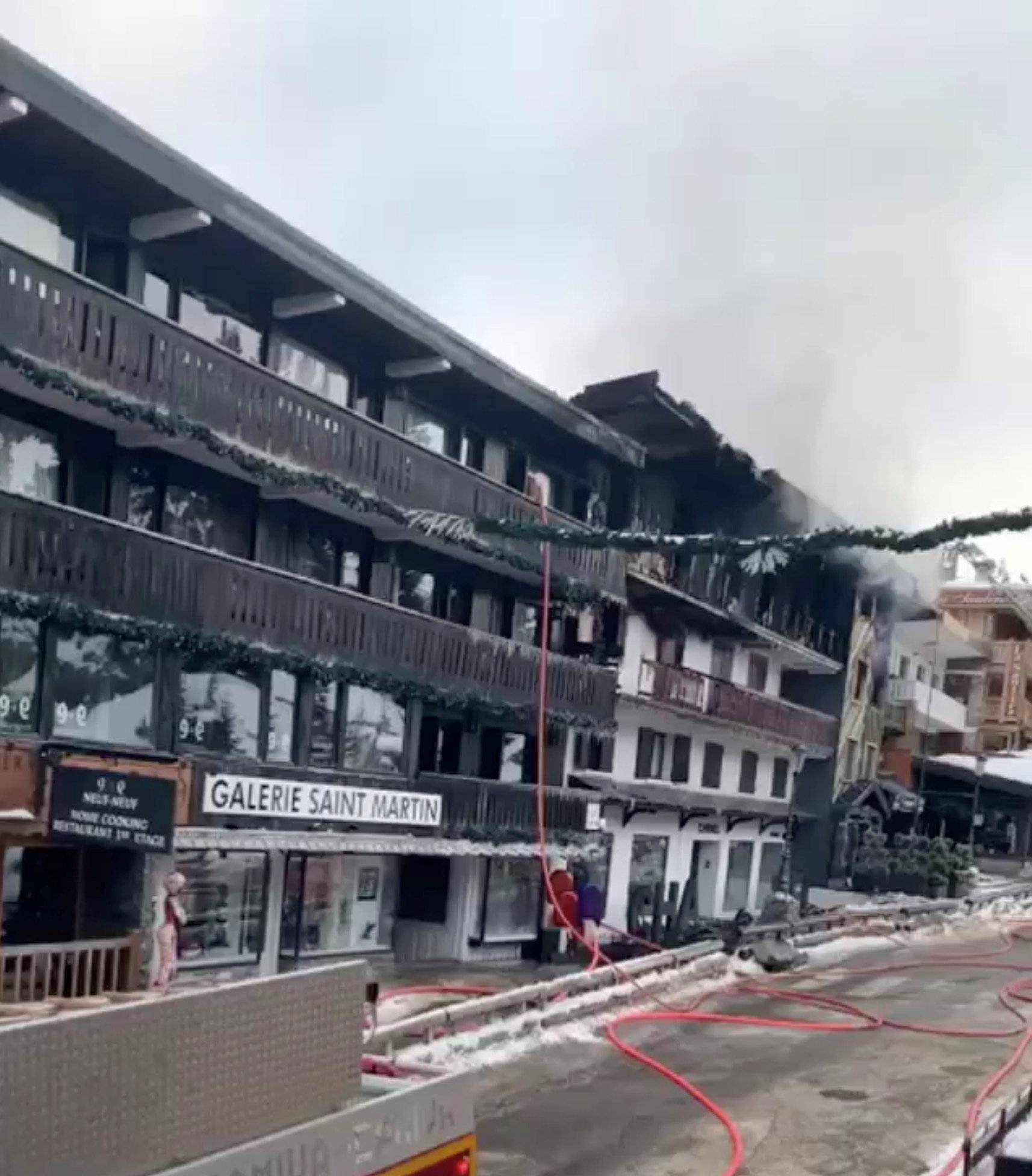 Smoke rises from a building after a fire at Courchevel ski resort