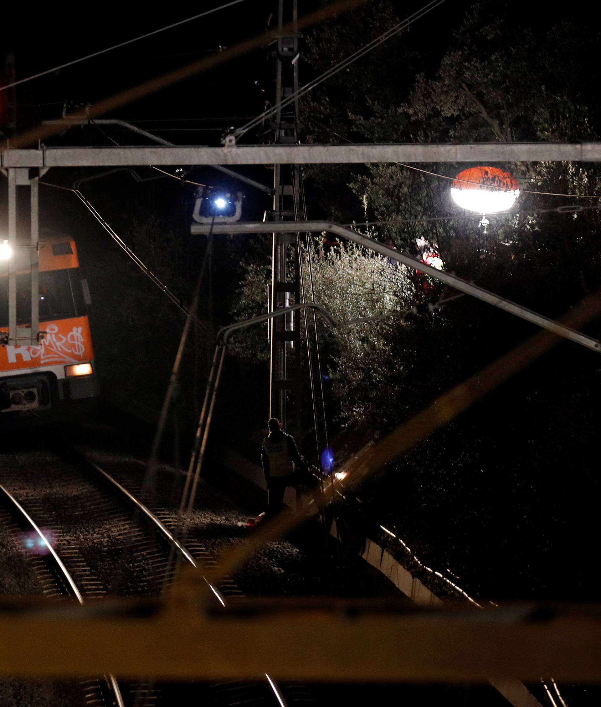 A train arrives to evacuate people after a train crash near Manresa
