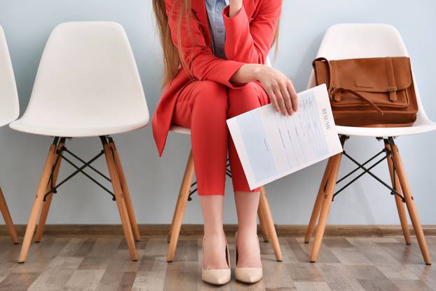 Young,Woman,Waiting,For,Interview,Indoors